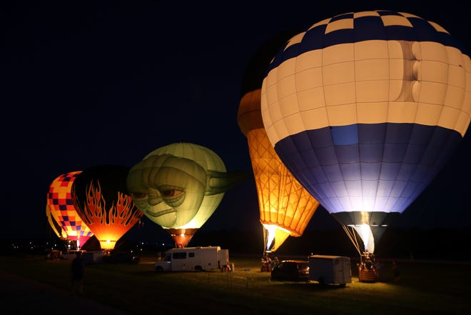 The balloons glow in the night sky for a cool light show once the sun sets.