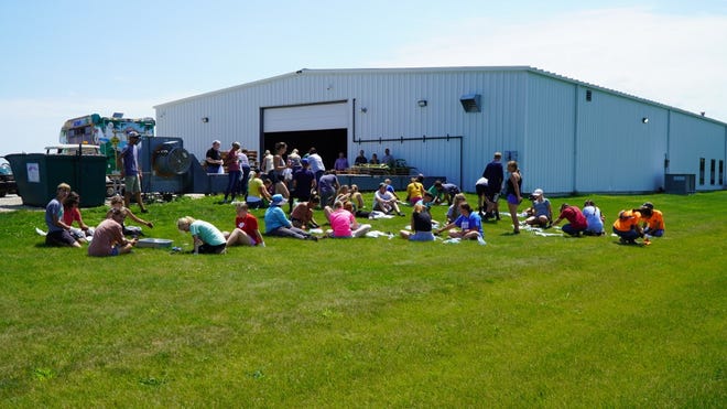 WORK HARD. PLAY HARD: Wyffels Hybrids ended their pollination season with a party for all seasonal help on August 2, 2022. Pollinators enjoyed pizza, Kona Ice and tie dying their new Wyffels Research Team t-shirts.