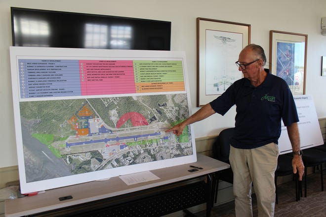 Howie Franklin, director of the Cape Fear Jetport, shows off the airport's 25-year growth plan, which includes the addition of 60 additional hangars.