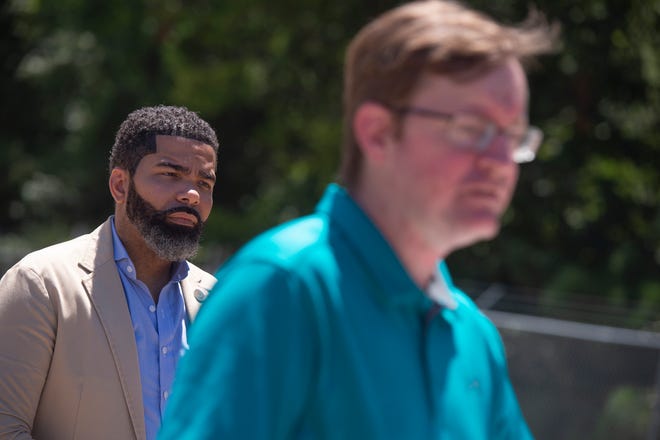 Jackson Mayor Chokwe Antar Lumumba, left, listens, as city engineer Robert Lee addresses the media during an update on the state of water treatment issues in the city during a news conference at the O.B. Curtis Water Treatment Plant in Ridgeland, Miss., Monday, Aug. 8, 2022.