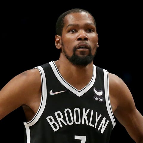 Brooklyn Nets forward Kevin Durant, left, and head