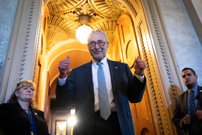 Senate Majority Leader Chuck Schumer, DN.Y., gives the thumbs up as he leaves the Senate Chamber after passage of the Inflation Reduction Act at the US Capitol August 7, 2022 in Washington, DC.