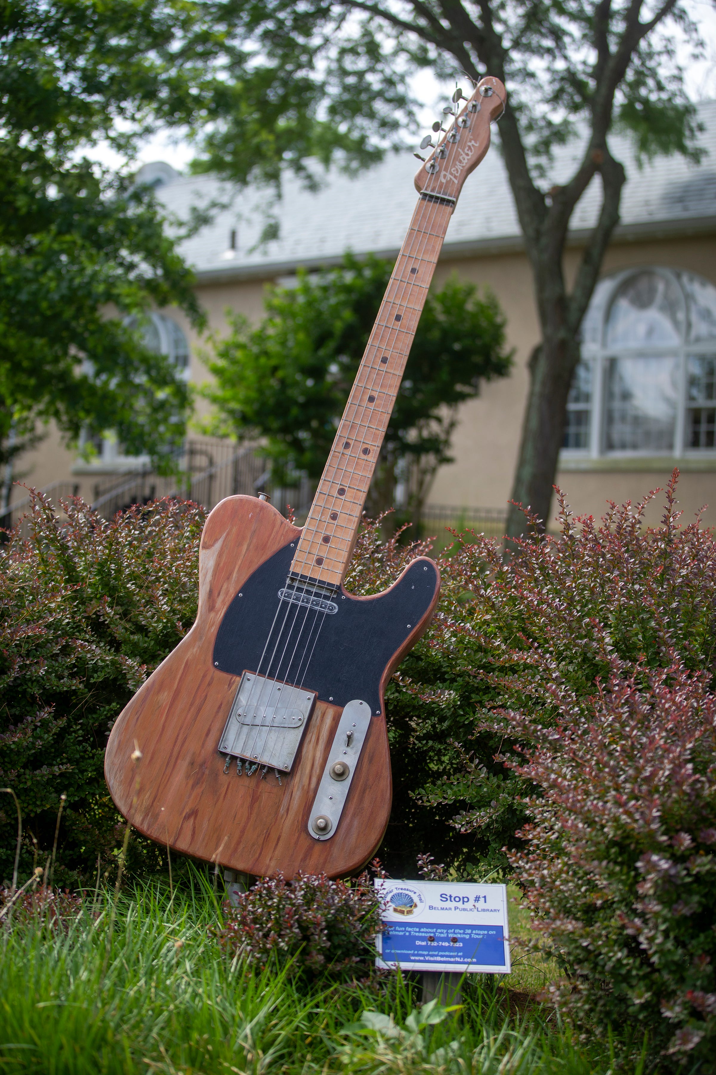 A large replica of Bruce Springsteen's Fender guitar stands outside of the Belmar Public Library, which is on the corner of 10th Avenue and E Street, in Belmar, NJ Wednesday, July 6, 2022. 