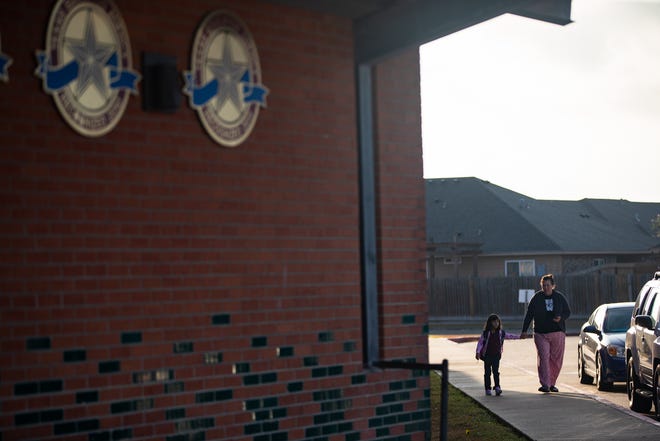 People walk toward the entrance at Dawson Elementary School on Corpus Christi ISD's first day of the 2022-23 school year on Aug. 9, 2022.