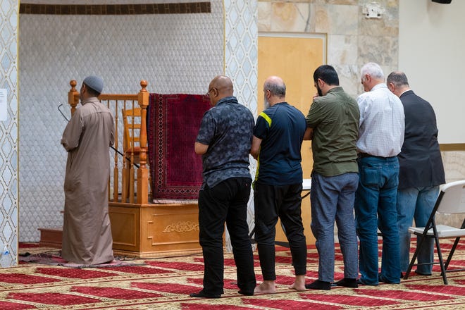 An imam leads afternoon prayer at the Islamic Center of New Mexico in Albuquerque on Aug. 7.