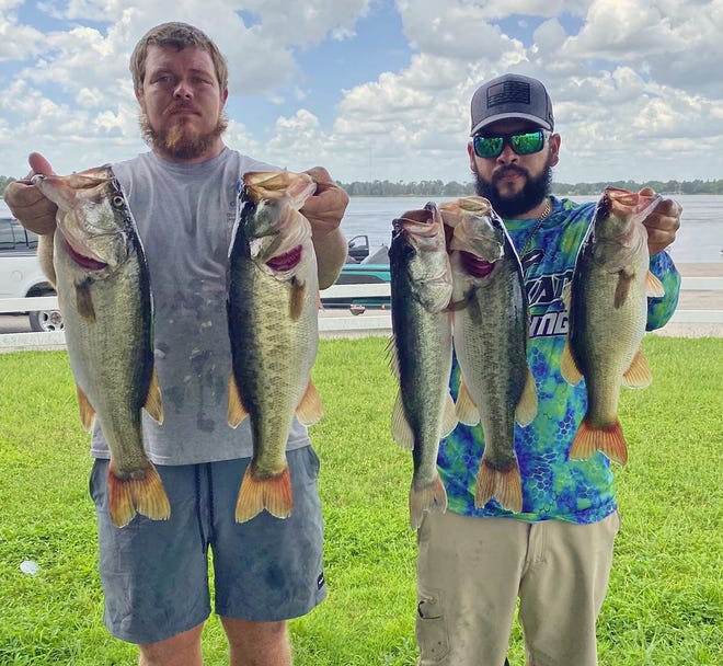Kenneth Meadows, left and Gabe Rivera had 18.45 pounds and also big bass with a 5.80 pounder to win the Happy Hookers Bass Club tournament August 6 on the Winter Haven Chain. 