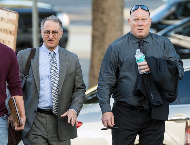 Boynton Beach police officer Michael Brown, right, and his attorney, Bruce E. Reinhart, arrive at the federal courthouse for Brown's trial Thursday, November 2, 2017, in which he  is accused of accused of violating the civil rights of a Boynton Beach man who was beaten up after a chase. (Lannis Waters / The Palm Beach Post)