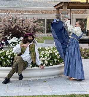 Brian Nolan, left, plays Benedick and Liz Zimmerman plays Beatrice in South Bend Civic Theatre's production of Shakespeare's "Much Ado About Nothing" that alternates performances with an adaptation of Jane Austen's "Sense and Sensibility" in the courtyard of the main branch of the St. Joseph County Public Library in South Bend. "Sense and Sensibility" opens Aug. 12, and "Much Ado About Nothing" closes the run Aug. 28.
