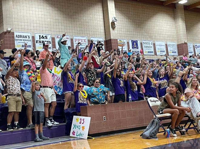 Merkel students cheer on the Lady Badgers in their volleyball match against Trent.