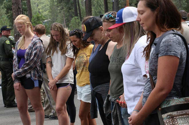 Supporters form a prayer circle following a press conference regarding missing 16-year-old Kiely Rodni at the Truckee Donner Community Recreation Center in Truckee on Aug. 9. Rodni was last seen near Prosser Creek Reservoir near Truckee on Aug. 6.
