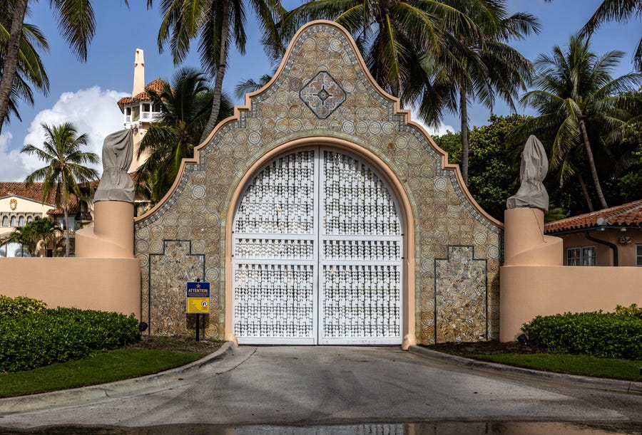The main gate at former President Donald Trump's Mar-a-Lago estate sits closed on Wednesday morning. The FBI searched the estate on Monday.