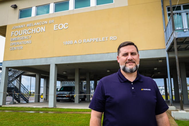 Executive Director Chett Chiasson stands in front of Port fourcon's emergency command center after touring the area July 25, 2022.