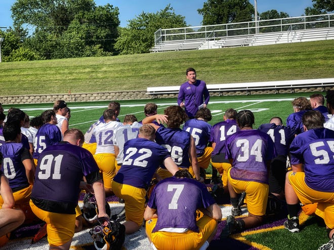 Knox College's Adam Ries, who is sharing the defensive coordinator responsibilities with Cody Hipp in 2022, talks to the Prairie Fire's football team after the first practice of the season Thursday at the Knosher Bowl.
