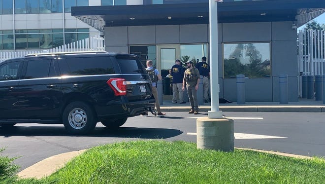 FBI and Federal Evidence Response Team agents are outside the FBI building in Kenwood gathering evidence following a possible threat this morning.