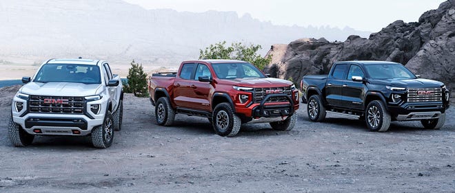 The 2023 GMC Canyon lineup includes the off-road-focused AT4X, center, and upscale Denali, right.