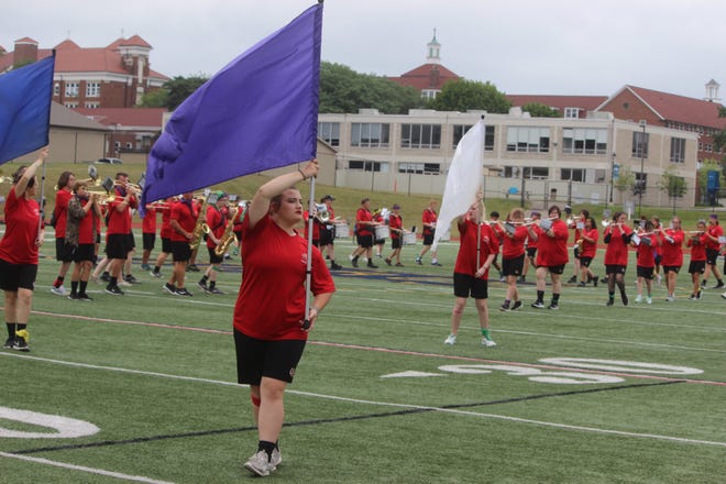 The Bedford High School Marching Band rehearses at Siena Heights University's O'Laughlin Stadium during its preseason band camp.