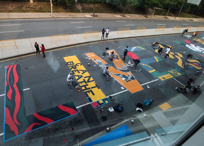 Artists and volunteers started painting at 6 a.m. July 15, 2020, and worked into the evening to finish the Black Lives Matter mural at the intersection of Major Taylor Boulevard and MLK Jr. Boulevard.