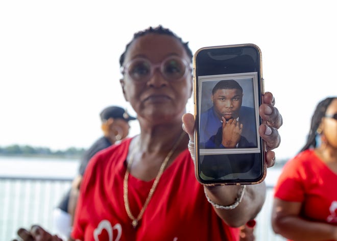 Laonis Quinn of Breathe: Anthony J. Chapman Asthma Foundation showing a photo of her son Tony Quinn, who died at the age of 23 in 2007 of an asthma attack.