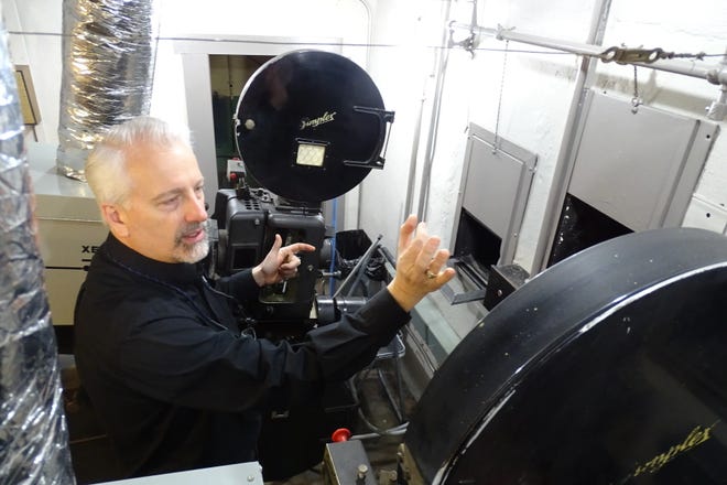 Mike Miller explains how the projectors are fed inside the Renaissance Theatre.