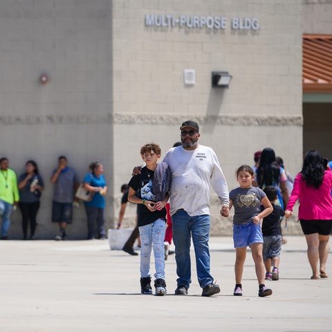 A family walks away from Thompson Ranch Elementary