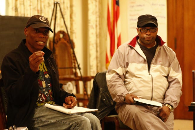Christopher Norfleet, left, and David Deon Stuart, both of Wausau, attend the People For The Power Of Love meeting Friday night at the First Universalist Unitarian Church in Wausau.