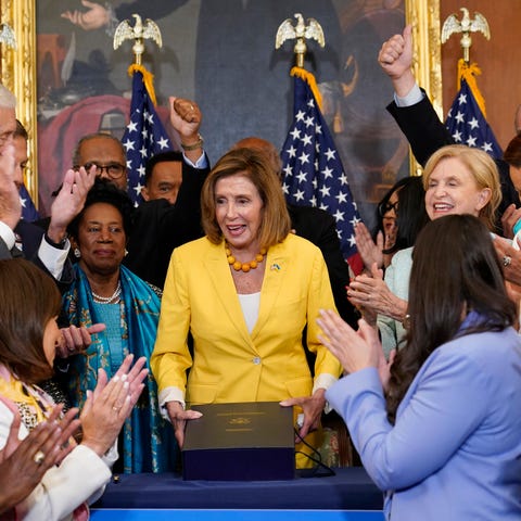 House Speaker Nancy Pelosi of Calif., surrounded b