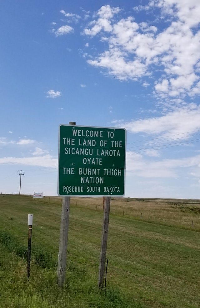 Sandy White Hawk will never forget the day she saw this sign, in 1988. For the first time in more than three decades, the Sicangu Lakota adoptee was home.