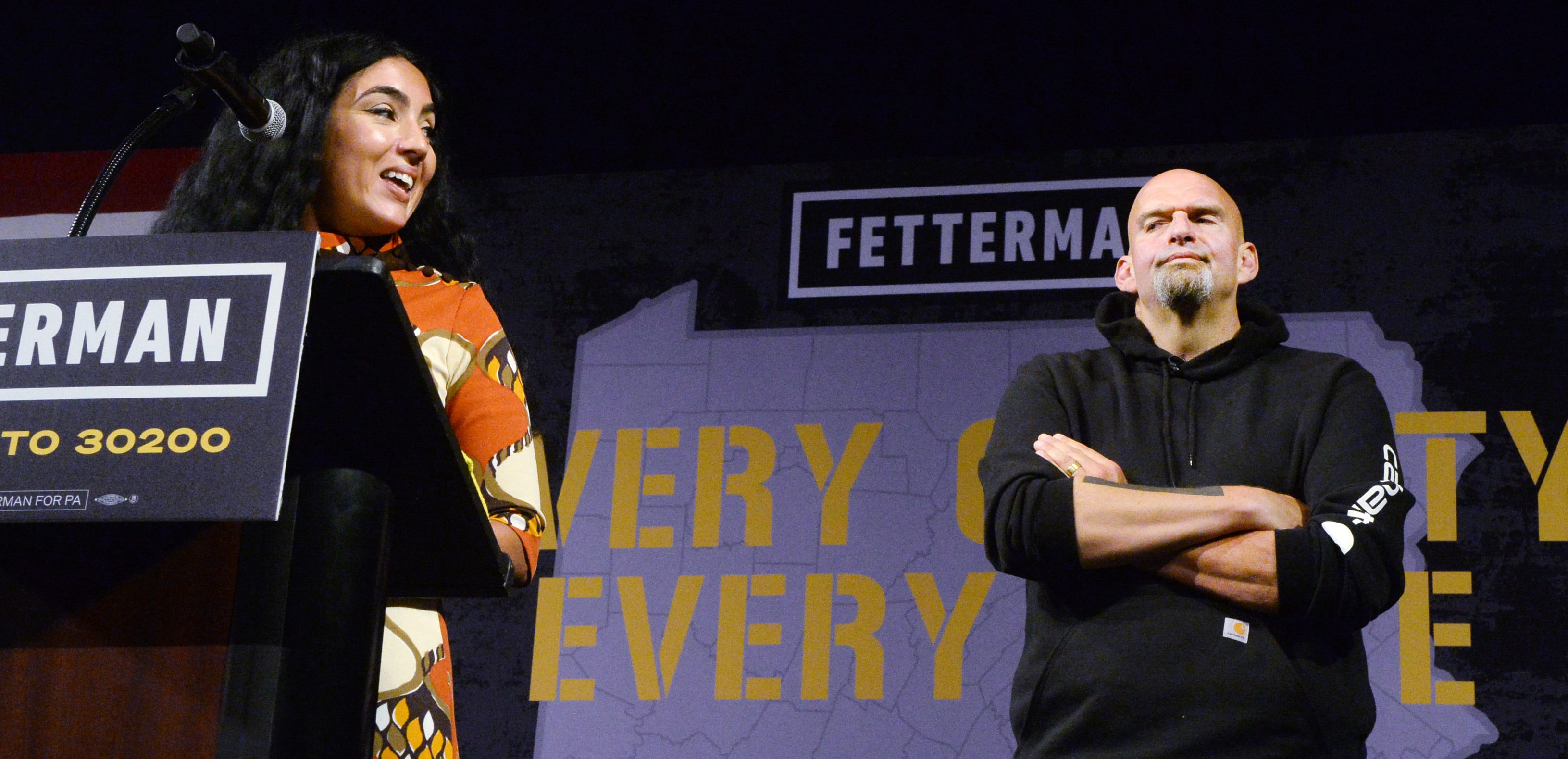 Gisele Fetterman, left, jokes with her husband, Pennsylvania Lt. Gov. and Democratic Senate nominee John Fetterman, inside the Bayfront Convention Center in Erie on Aug. 12, 2022. It was Fetterman's first campaign event since suffering a stroke on May 13.