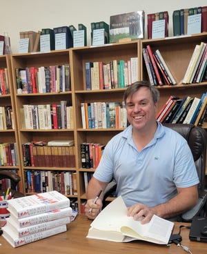 "This Will Not Pass" coauthor and The New York Times National Political Correspondent Jonathan Martin signs copies of his book in Watertown on Friday.