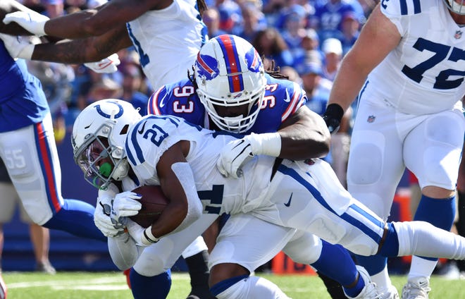 Aug 13, 2022; Orchard Park, New York, USA; Buffalo Bills defensive tackle Brandin Bryant (93) makes a tackle on Indianapolis Colts running back Nyheim Hines (21) in the first quarter pre-season game at Highmark Stadium. Mandatory Credit: Mark Konezny-USA TODAY Sports