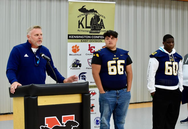 Wayne Memorial coach Mike Ryan (left) speaks to the media during the Kensington Lakes Activities Association Football Media Day on Friday, August 12, 2022.