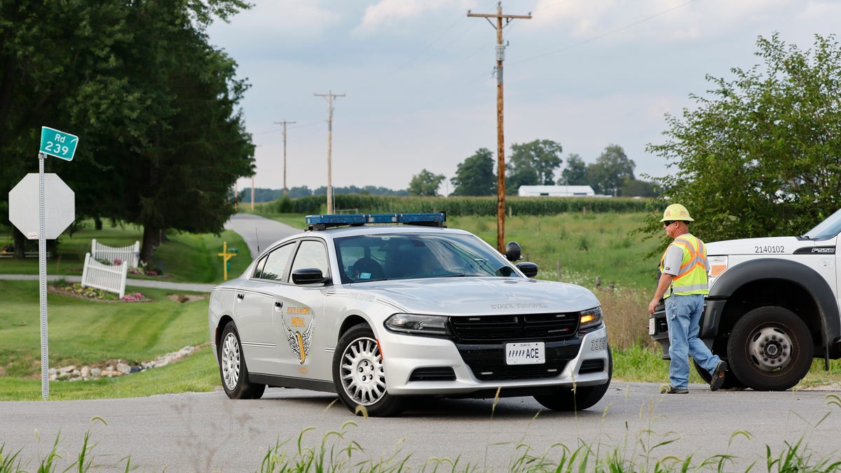 The scene in Clinton County, Ohio, near where an armed man was shot and killed after police say he tried to breach the FBI's Cincinnati field office Thursday, Aug. 11, 2022.