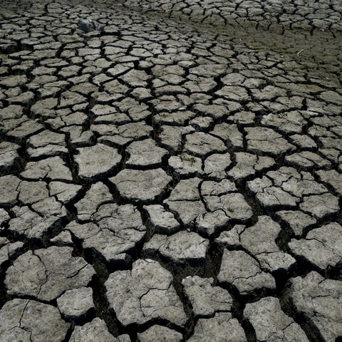 Dry, cracked land is visible in The Boca reservoir
