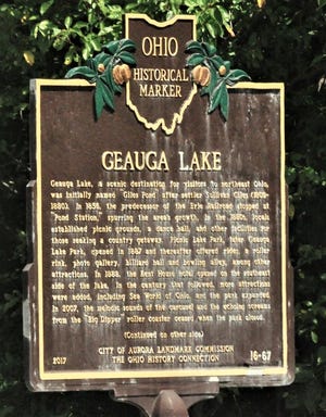 A historical marker placed by the Aurora Historical Society stands along Route 43 between the Geauga Lake Improvement Association's lakefront park and the old Geauga Lake ballroom.