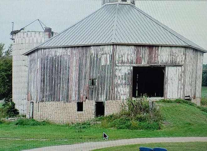 An eight-sided barn under construction.