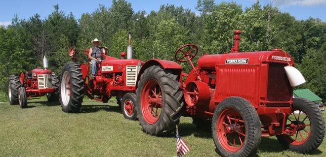 Seated on his Farmall 350 row-crop, Much is flanked by a 350 International utility and a 10-20 McCormick-Deering, which was part of the first Thresheree.