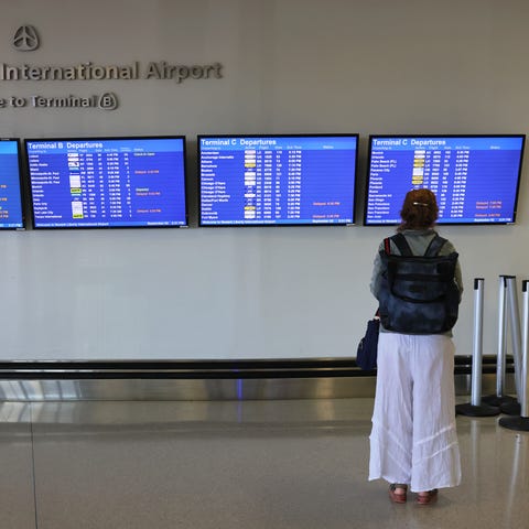 NEWARK, NEW JERSEY - SEPTEMBER 02: A woman looks a