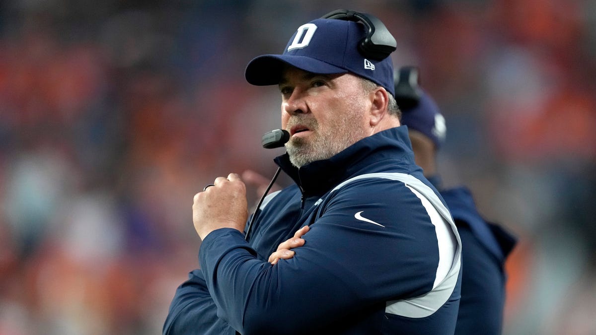 Dallas Cowboys head coach Mike McCarthy watches during the first half of an NFL preseason football game against the Denver Broncos, Saturday, Aug. 13, 2022, in Denver.