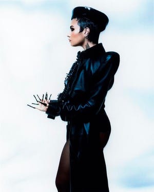 Demi Lovato's new album grapples with demons, death, sex: Review 2 Demi Lovato taps into her pop-punk leanings on her eighth album.