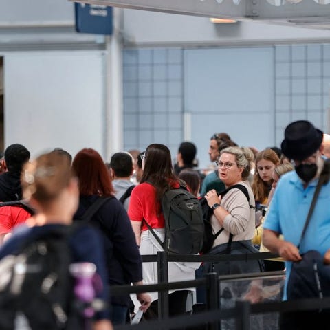 Travelers wait in line at O'Hare International Air