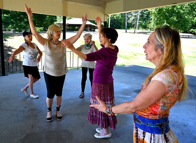 SHREWSBURY - Members of Silver Moon Gypsies practice their "gypsy fusion" style of dancing under a pavillion at Dean Park on Tuesday. 