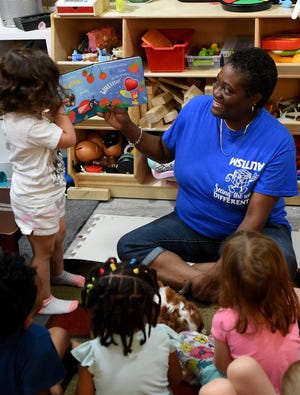 Sylvia Stafford reads a story to a group of young children on Tuesday, Aug. 16, 2022 from her Pataskala home in the Brooksedge housing development. Stafford, who runs a home daycare, has been fighting with her HOA about running the business from her home since June 2019.