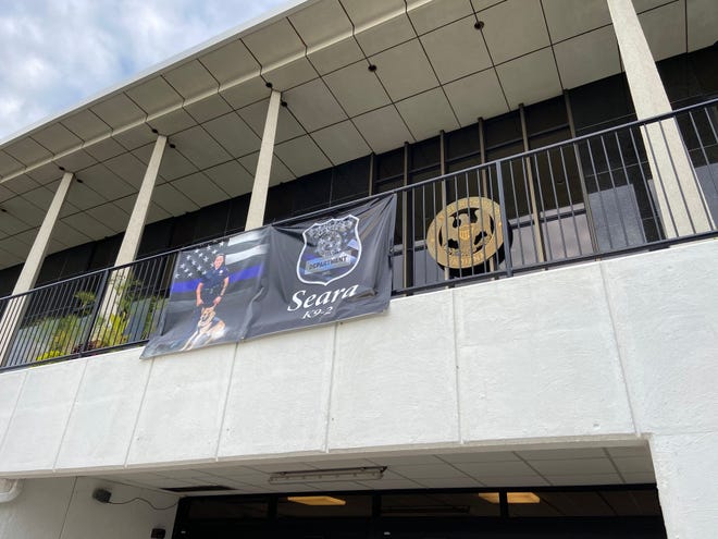 A banner honoring Seara Burton hangs above the police department entrance to the Richmond Municipal Building.