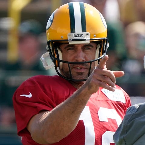 Green Bay Packers' Aaron Rodgers runs a drill befo