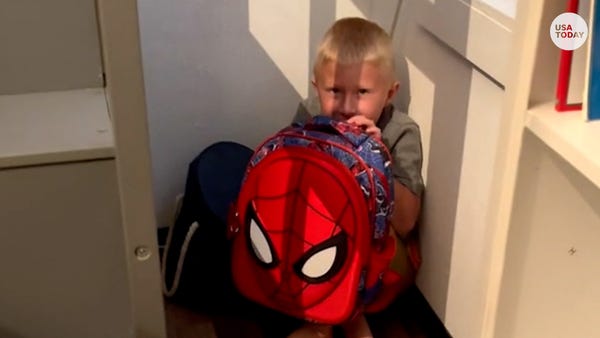 Child learning how to use bulletproof backpack