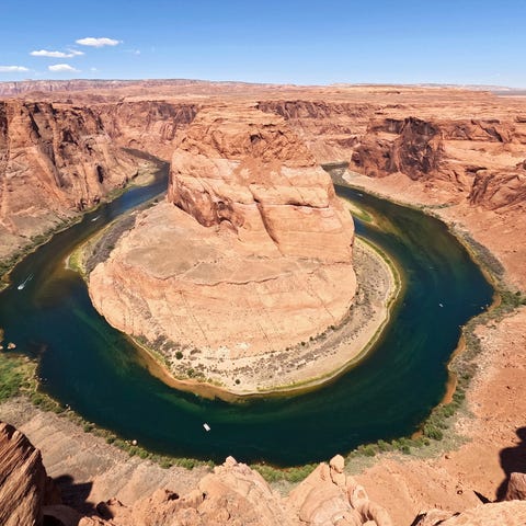 The Colorado River flows at Horseshoe Bend in the 