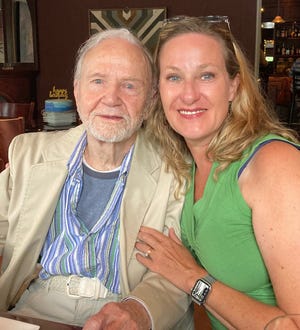Bascom Biggers III takes a portrait with Holly Christensen on his 100th birthday.