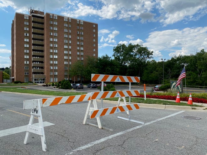 College Avenue remains blocked at West Church Street in Adrian due to the risk posed by the structural problems at the Riverview Terrace apartment building, pictured Wednesday, Aug. 17, 2022.