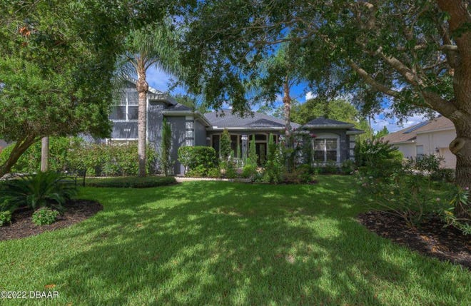 The owners of this Ormond Beach home have added a gorgeous 470-square-foot great room with soaring ceilings, a cozy fireplace and perfectly placed windows, transforming it into a one-of-a-kind property.