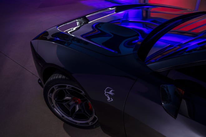 Brushed aluminum banshee fender decals announce the new drivetrain powering the Dodge Charger Daytona SRT Concept.